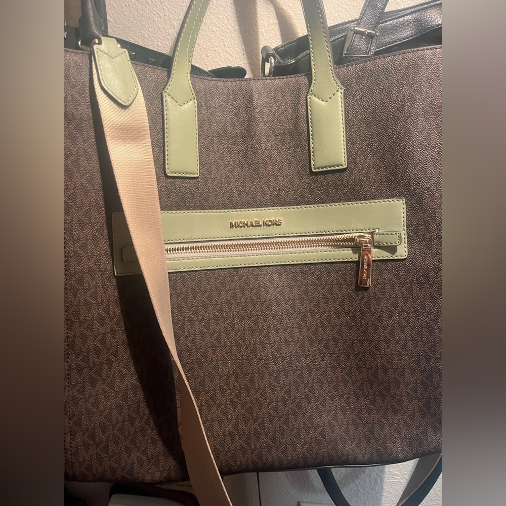 Michael Kors bag, great to hold professional, and personal items.